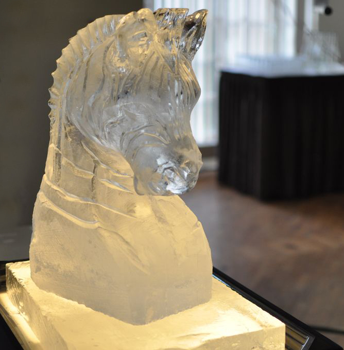 zebra or horse or seahorse head carved from pure ice