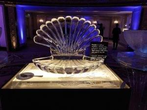 Open Scallop ice sculpture with lighting effect at a food display at the Dorchester Hotel in a fancy setting